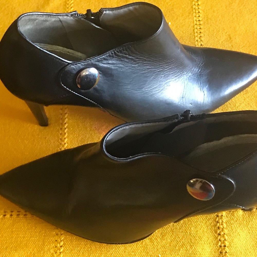 Black booties with silver snap trim